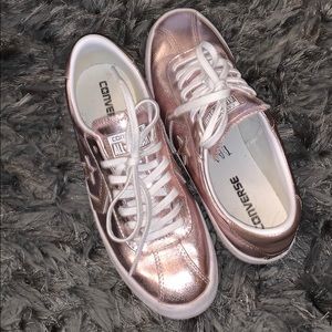 Pink metallic Converse tennis shoe